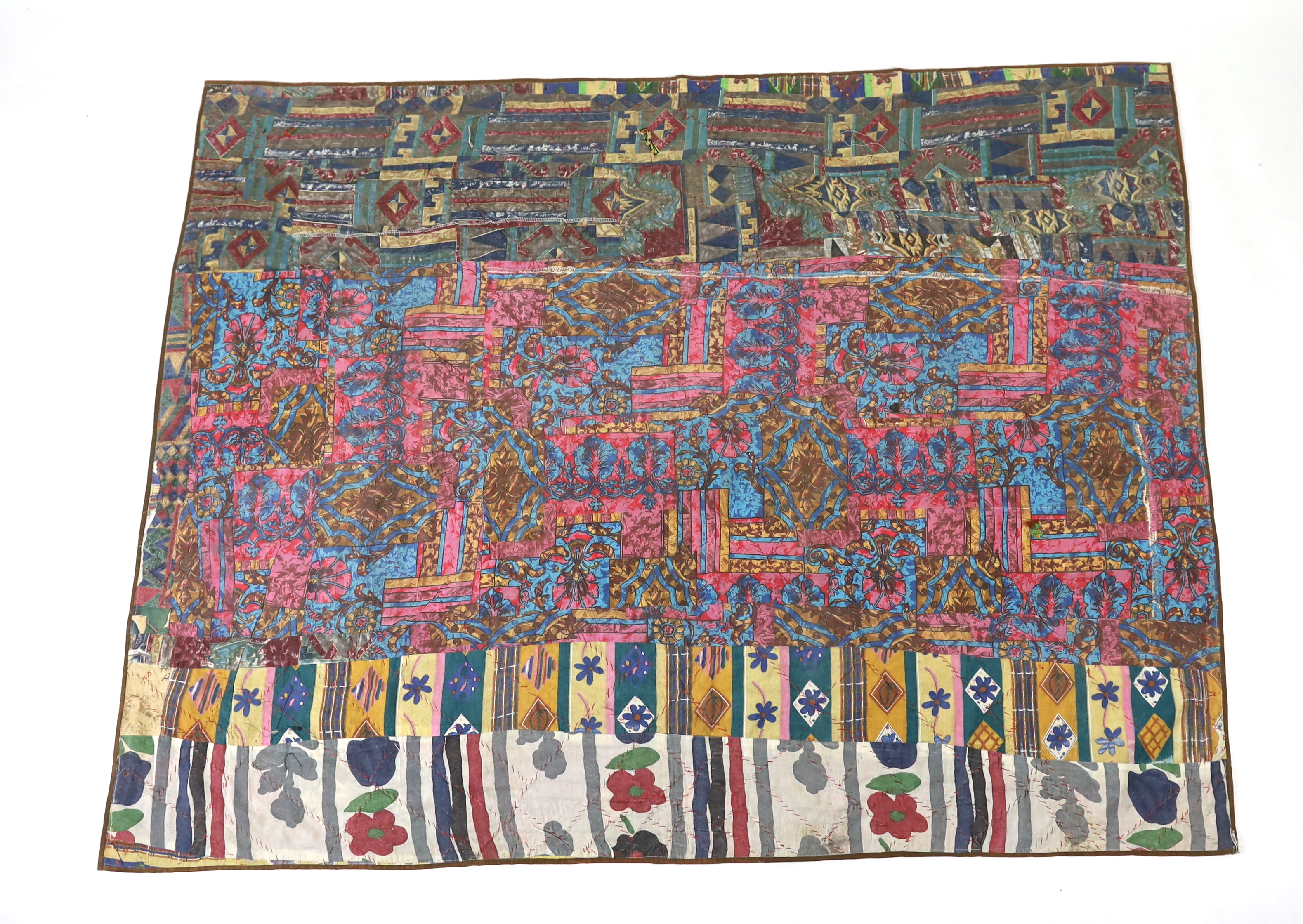 An interesting 20th century North Indian or Tibetan patchworked cover, worked in silk, wool and cotton embroidery in varying colours using thick bundles of threads to border / outline the patchwork, this has possibly bee